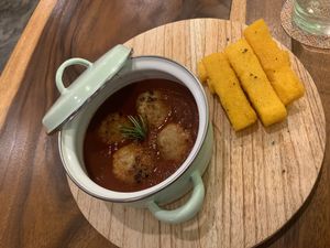 meatballs in tomato sauce and polenta sticks at Amami Garden in Ungasan