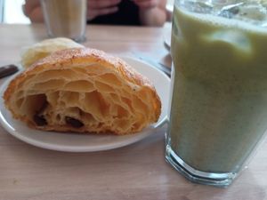 Matcha matte and pan au Chocolat at The Flour Pot Bakery in Brighton