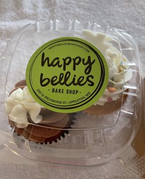 Chocolate and a vanilla cupcake   at Happy Bellies Bake Shop in Appleton