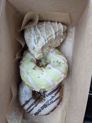 Vegan donuts and scone (from top: funfetti scone, pistachio raspberry donut, espresso donut). at Happy Bellies Bake Shop in Appleton