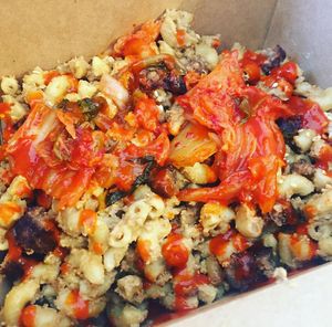 Smoky Mac n cheese with crispy tofu bits and kimchi. I added siracha!  at Animal Liberation Kitchen in Toronto