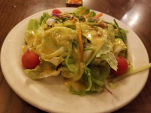 Coronation Salad comes with curry dressing. Not spicy, just flavorful. 
 (Vegan and gluten-free.) at Walt Disney World - Rose & Crown in Lake Buena Vista