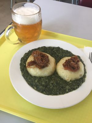 potato dumpling filled up with smoked tofu, served with spinach and beer! Thee best possible! at Eaternia in Prague