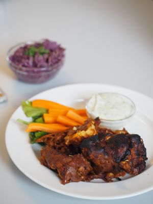 Vegan buffalo wings made of cauliflower at Eaternia in Prague