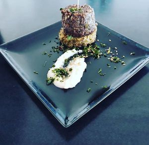 Sauteed Mushrooms marinated in red wine with Roasted Almonds complemented with a Canellini bean and garlic puree.
 at Cielo in Murcia