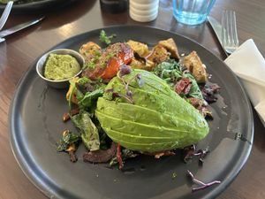 Tofu scramble - pesto and avocado with hash browned potato underneath!   at Ajuna Eatery in Napier