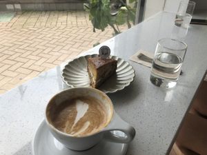 Oat latte and carrot cake  at Divine Planet Vegan Cafe in Wuxi