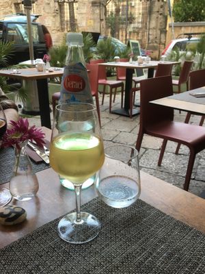 Watwr and wine on the terazza at A'nica in Palermo
