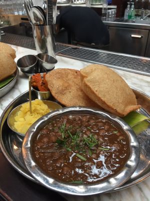 Vegan Chole Puri, spiced chickpea curry and sweet halwa  at Dishoom - King's Cross in London