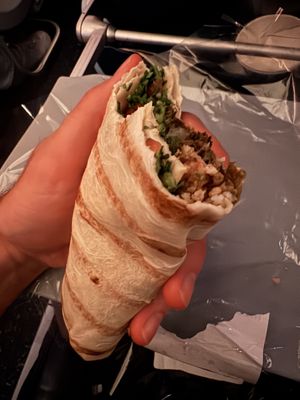 Half eaten Mediterranean wrap. Still quite a bit left!  at DTW - Plum Market in Romulus
