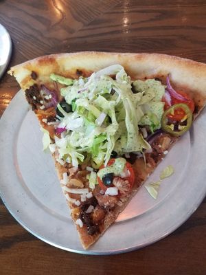 Vegan Taco bout it slice w impossible taco crumbles at California Sun in Los Angeles