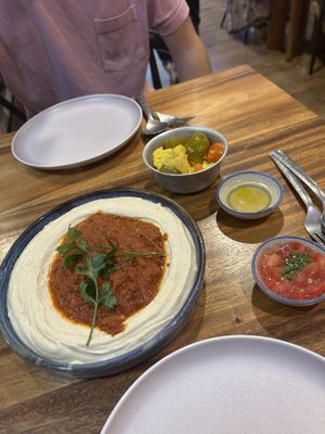 Shakshuka hummus (asked for no egg) it comes with pickled veggies and 2 dips  at Hummus Chiang Mai in Chiang Mai