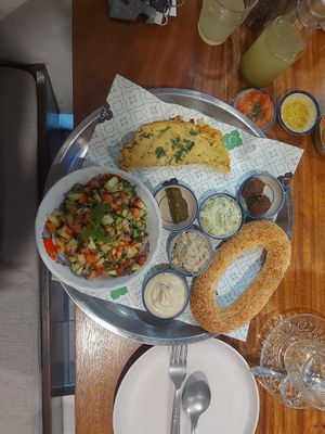 Breakfast plate with chickpea omelette at Hummus Chiang Mai in Chiang Mai