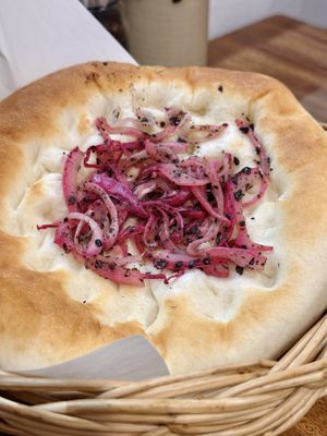 Onion sumac manakish (50 THB)  at Hummus Chiang Mai in Chiang Mai