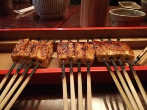 Freshly cooked tofu skewers with soy marinade at Wakaya Tofu in Iga