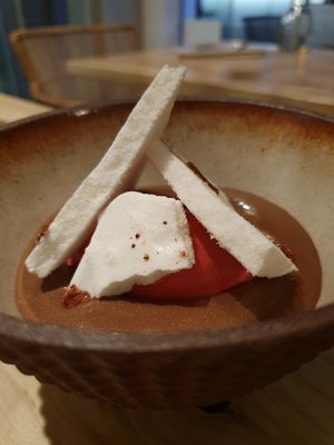 Divine vegan dessert. chocolate and mareng and rusberry at Hügge in Turku