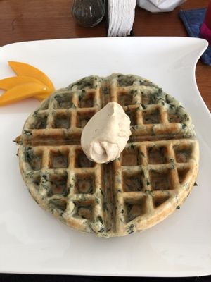 Chaya waffle served with cashew cheese and citrus habanero syrup  at Origin  in San Pedro