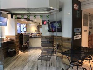 Some outdoor seating at Tropical Tribe in Honolulu