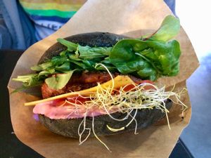 Beyond Burger with vegan cheese on charcoal bun  at Two Monkeys in Copenhagen