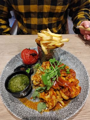 Cauliflower steak, salsa Verde, grilled tomato and mushroom, chips at Auchrannie Resort in Isle Of Arran