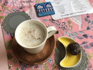 vegan latte & chocolate ball 😍 at Cafe Ethic in Manali
