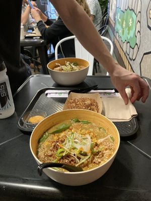 Foreground: spicy curry ramen. Miso macaroni. Background: dragon breath ramen.   at REDWHITE BONELESS RAMEN - Boston in Boston