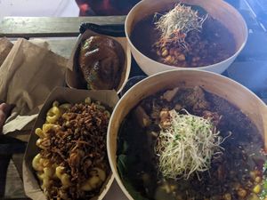 Two bowls of ramen, the Mac n miso, and miso roasted avocado. Sorry for the bad lighting! at REDWHITE BONELESS RAMEN - Boston in Boston