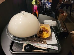Cloud of smoke above the Ramen bowl at REDWHITE BONELESS RAMEN - Boston in Boston