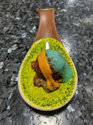 Plantain and bean ball on salsa with chipotle cheese at The Culinary Alchemists in Nuevo Arenal