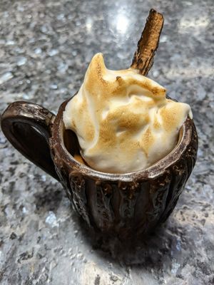 Hot chocolate of various ingredients (such as maca) topped with vegan meringue. at The Culinary Alchemists in Nuevo Arenal