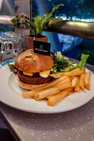 Small but delicious beyond burger with vegan Swiss cheese
 at SIN - Prive - Jewel  in East Singapore