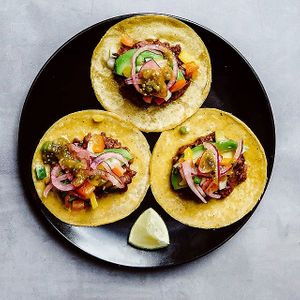 Tacos with refried beans, avocado, chimol, red onions in lime juice and salsa verde. at Tacopop in Copenhagen