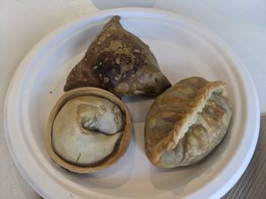 Corn empanada, samosa (triangle shape), burrito empanada (left to right) at The Plantisserie in Miami