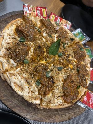 Chkn butter masala pizza  at Loving Hut - Vegan Paradise in Gurgaon