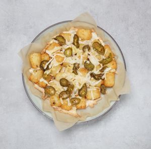 Vegan Cheese Potato Tots with Jalapeño: Oven baked potato tots topped with vegan cheese and Jalapeños at Papa John's in Sevenoaks