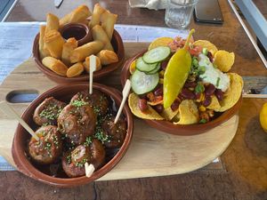 Second part of the tapas board. Fried springrolls, sticky mushrooms and loaded nachos. at Bistro Calypso in Eindhoven