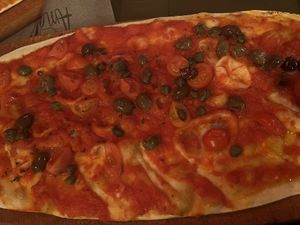 Pizza mediterranea- capers, olives, datterini amd tomato sauce  at AmaMi in Milan