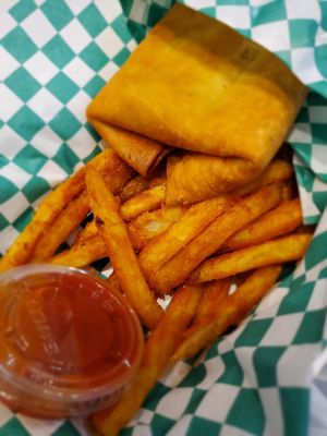 Vegan pizza puff with fries at Can't Believe It's Not Meat - Hyde Park in Chicago