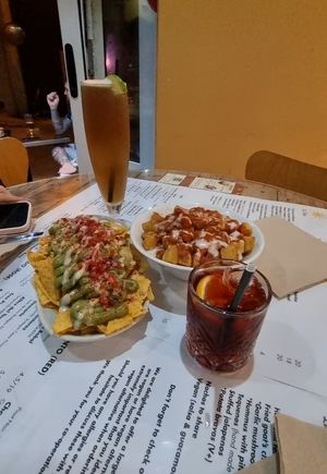 Nachos and patata bravas, long island icetea on the left and negrino on the right. at La Vida in Sliema