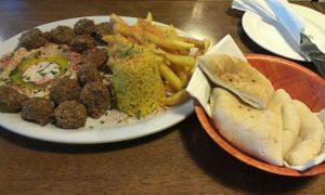 Roni's Falafel on a plate with humus and half rice half chips with pita at Chi Thu - Fraunhoferstrasse in Munich