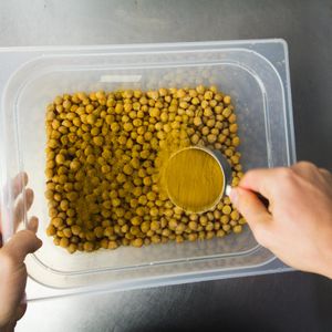 about to roast a batch of curry chickpeas.  at Rå Bowls & Juices in Groningen