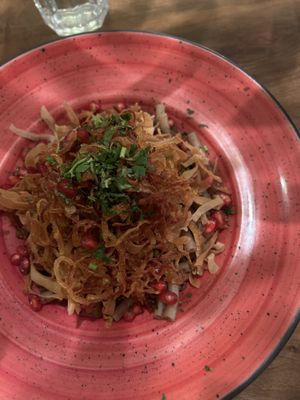 Vegan Lebanese macaroni with pita chips, fried onion, lentils, pomegranate seeds  at Naranj in Marrakech