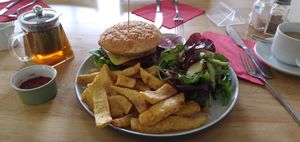 Hawaiian burger and lapsang souchong tea. (Every morsel devoured). at Sweet Pepper Cafe in Barrow-in-furness