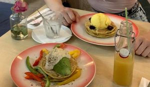 Savory pancake with hummus, bell pepper and avocado. Sweet pancake with safran-pistachio ice cream, blackberries and maple syrup. at Moak Pancakes - City Center in Amsterdam