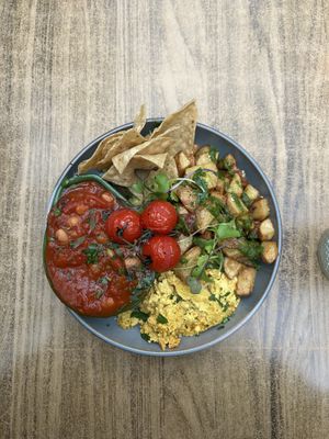 Tofu scrambled eggs, tortilla chips and guacamole, beens and tomato sauce, potatoes   at Jungle Cafe in Galway