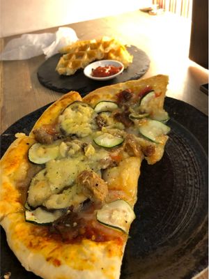 Vegan pizza and potato waffles at Queen's Healthy Diner in Nagoya