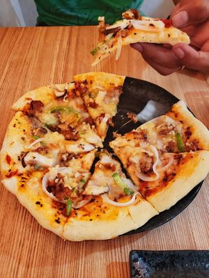 First pizza, (yes we ordered two, yes they were amazing) 1700 yen each, worth the price in taste! at Queen's Healthy Diner in Nagoya