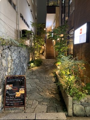 View from the street. Restaurant is located behind the staircase. at Queen's Healthy Diner in Nagoya