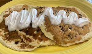 Vegan chocolate chip pancakes with coconut whip! Amazing!  And yes the choco chips are vegan too!  at Deja Vu Diner in Orangeville