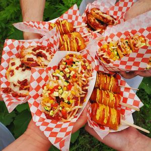 Gluten-free corn dogs, pepperoni pizza bagels, and vegan veggie pizza bagels featured as an exclusive and off-menu item at Penn Avenue's First Fridays! at Gluten Free Goat Bakery and Cafe in Pittsburgh